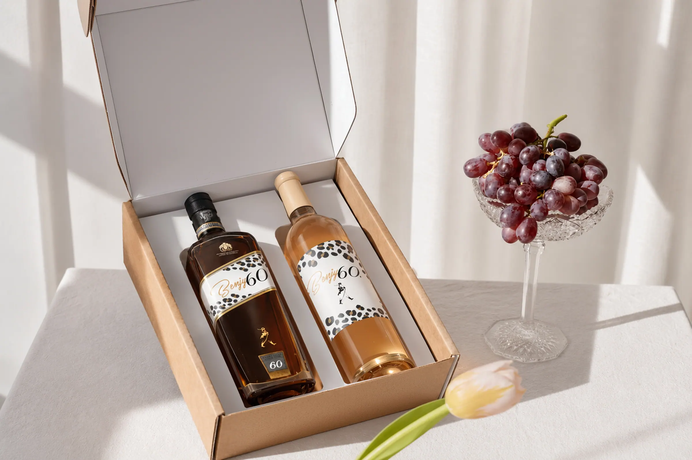 Benjy 60 gift box open on a table showing both bottles seated in the tray