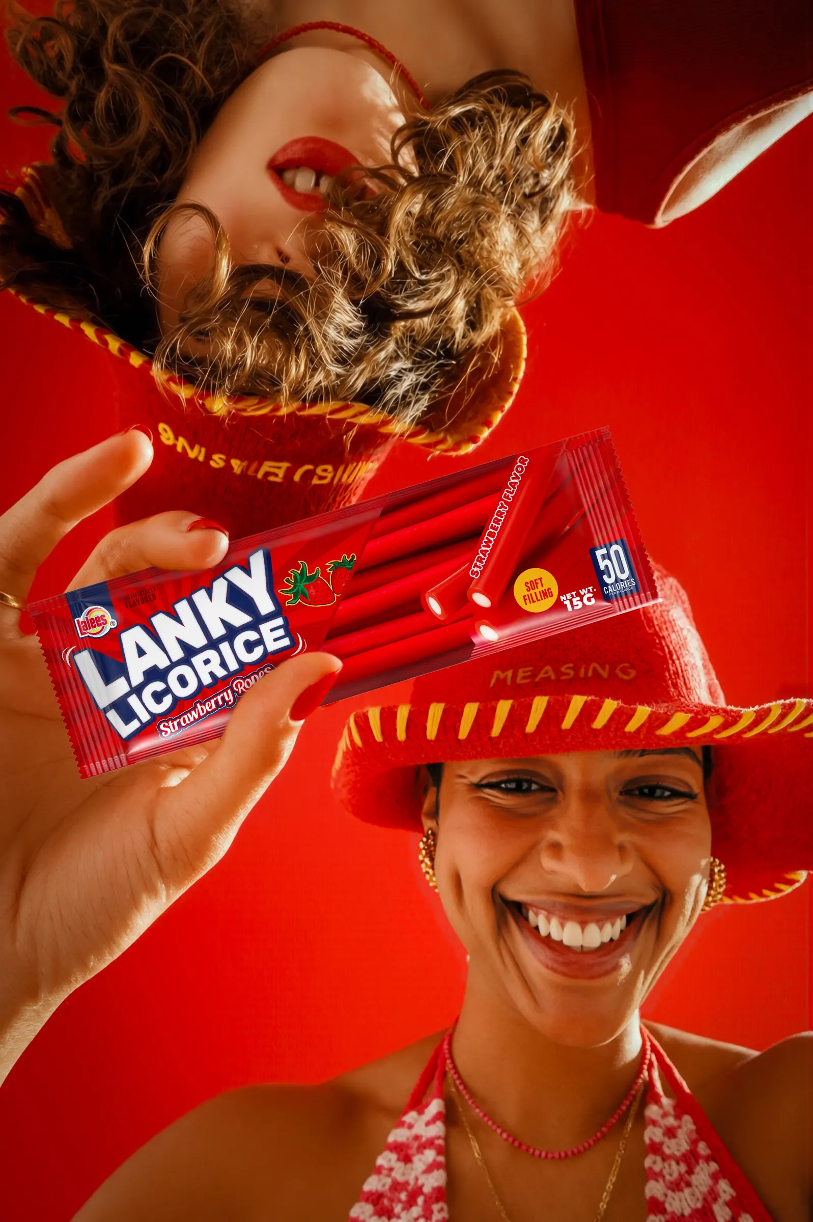 Woman laughing while holding Lanky Licorice packs